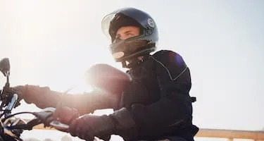 Motorcyclist enjoys a sunny day on their motorbike