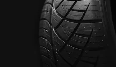 A close up of a car tyre tread with pattern