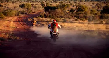 Two motorcyclists ride through the NT
