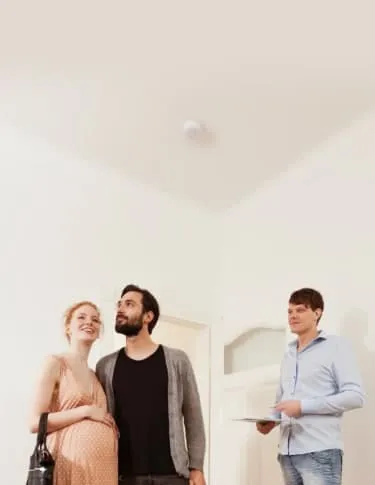 Expecting parents looking at house with real estate agent