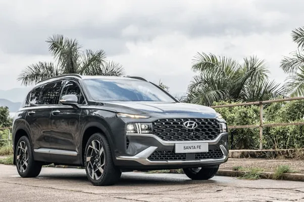 black Hyundai Santa Fe parked on road outside