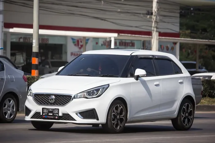 white MG3 parked on road outside