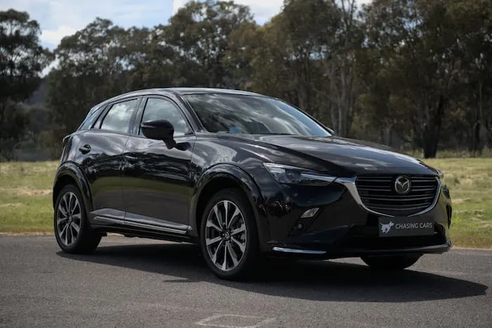 Black Mazda CX3 parked on road outside