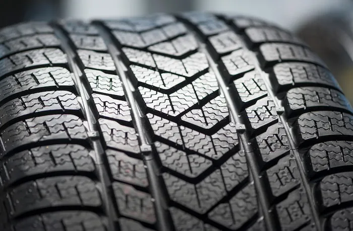 A car tyre that has a zigzag grippy tread