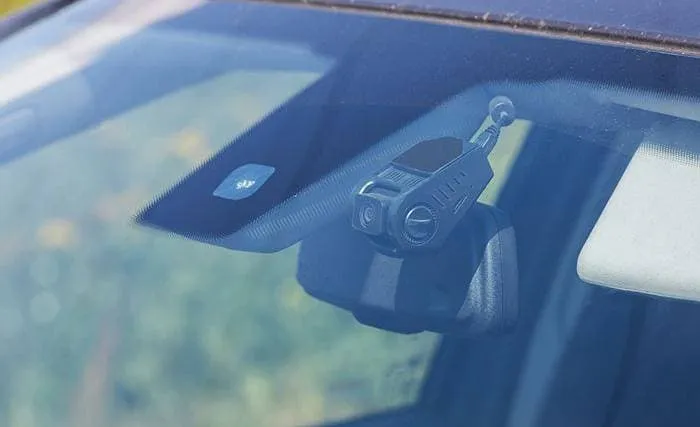 Close up view of a car windscreen with a dashcam visible