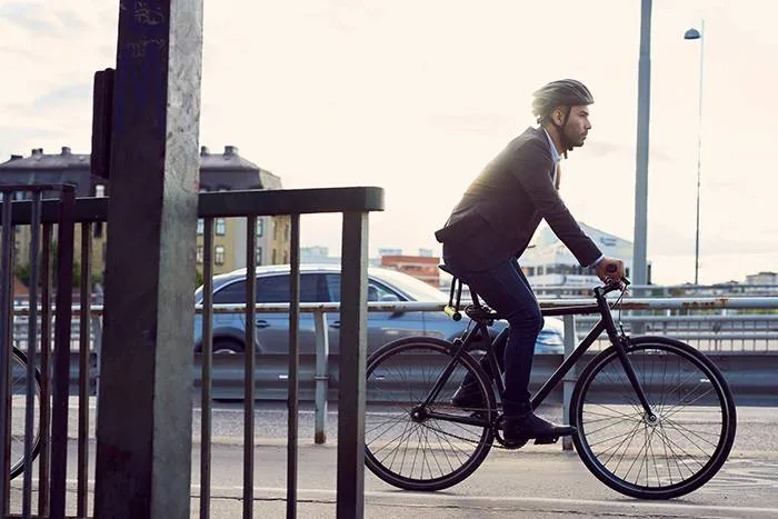 Businessperson cycling to work.