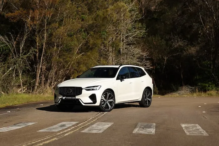 White Volvo XC60 is parked on a road at a crossing
