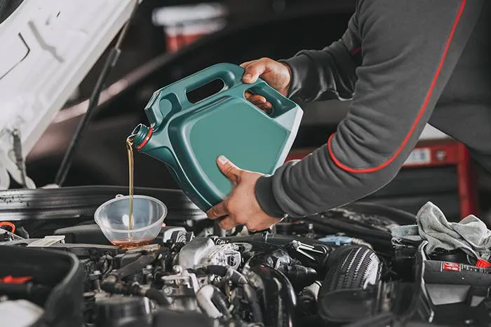 Refilling oil in open car bonnet