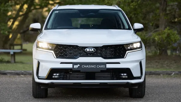 white Kia Sorento parked outside