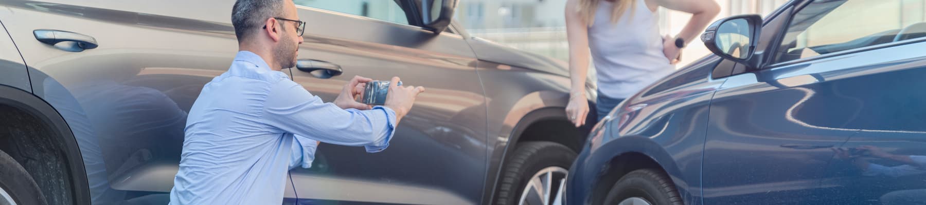 Man takes photo for insurance after car crash