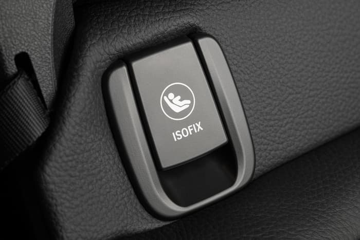 The ISOFIX symbol on an ISOFIX anchor point inside