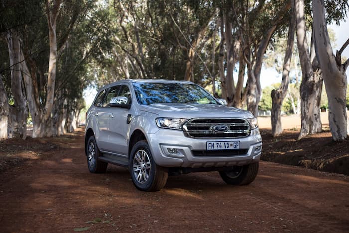 silver Ford Everest parked on dirt outside
