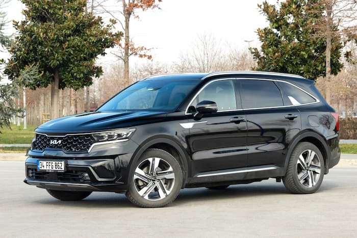 black Kia Sorento parked on the road outside