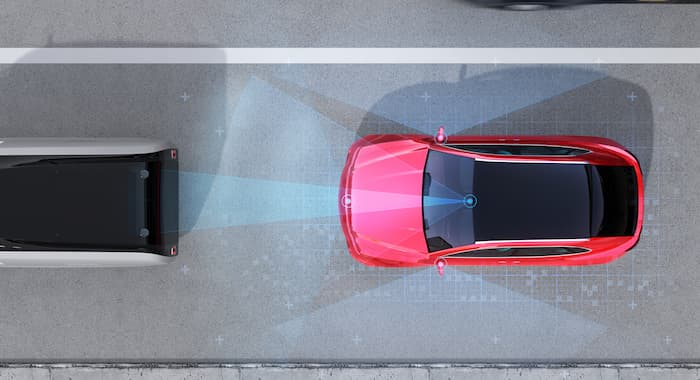 An aerial view of a car and its sensors avoiding a collison