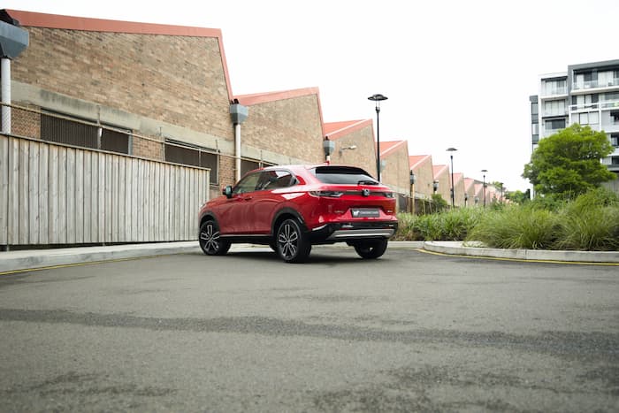 red Honda HR-V parked in car park