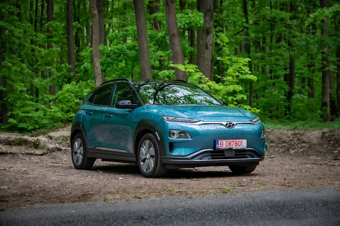 Hyundai Kona electric blue parked in park