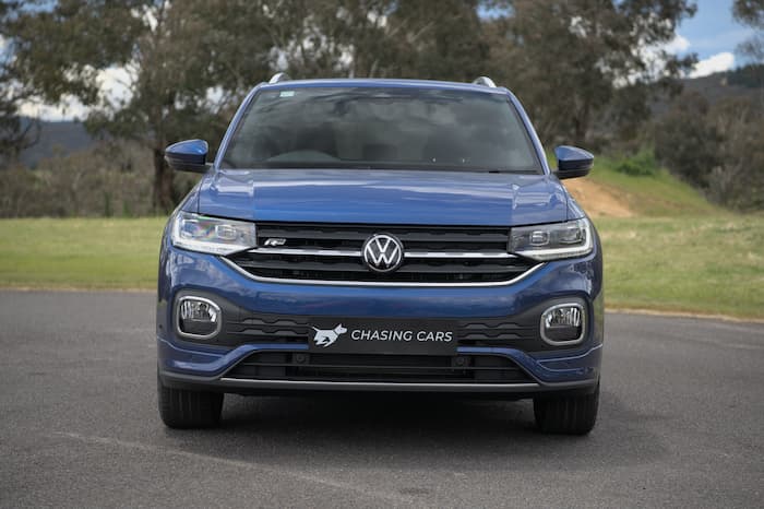 blue volkswagen t-cross parked on road outside