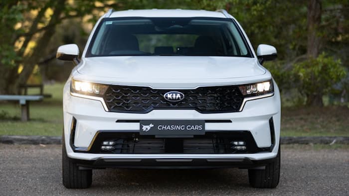 white Kia Sorento parked outside