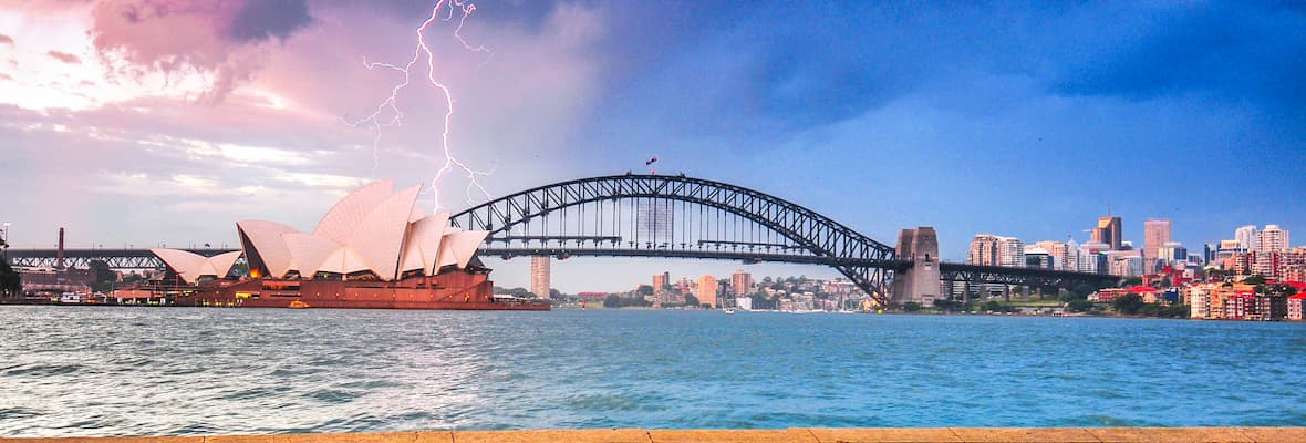lighting striking over sydney harbour bridge during storm