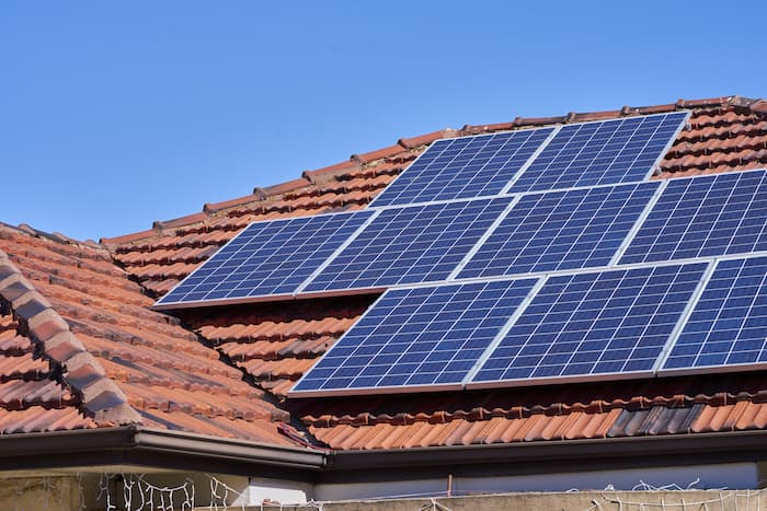 Solar panels on a terracotta roof in Australia