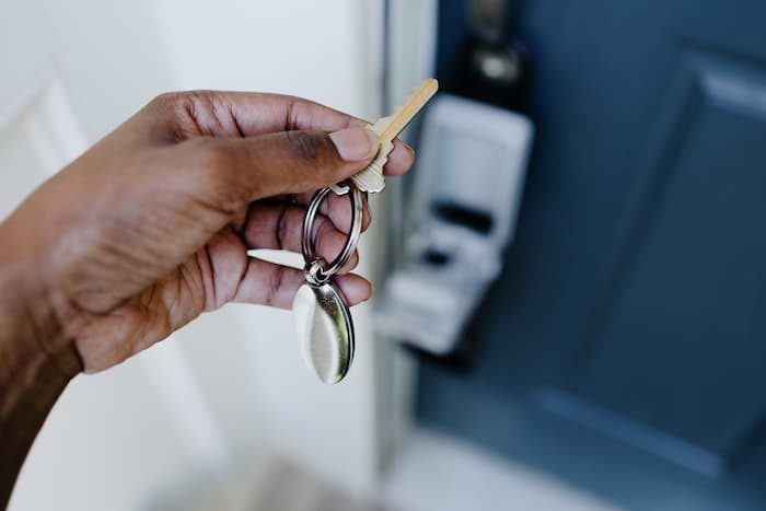 Homeowner retrieve a house key from a lockbox