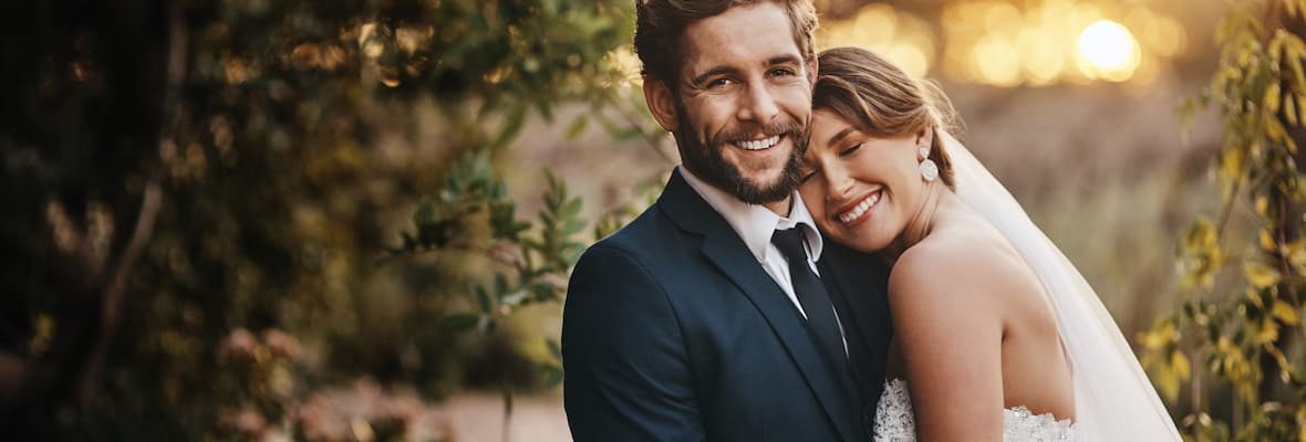 Bride and groom pose for photos on their wedding day