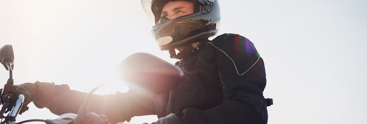 Motorcyclist enjoys a sunny day on their motorbike