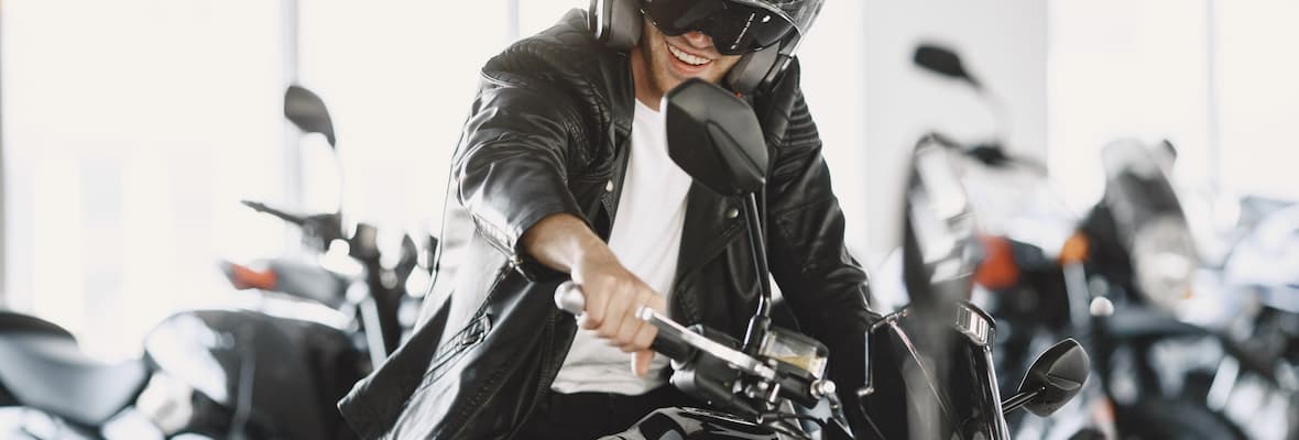 Man chooses which motorcycle to buy