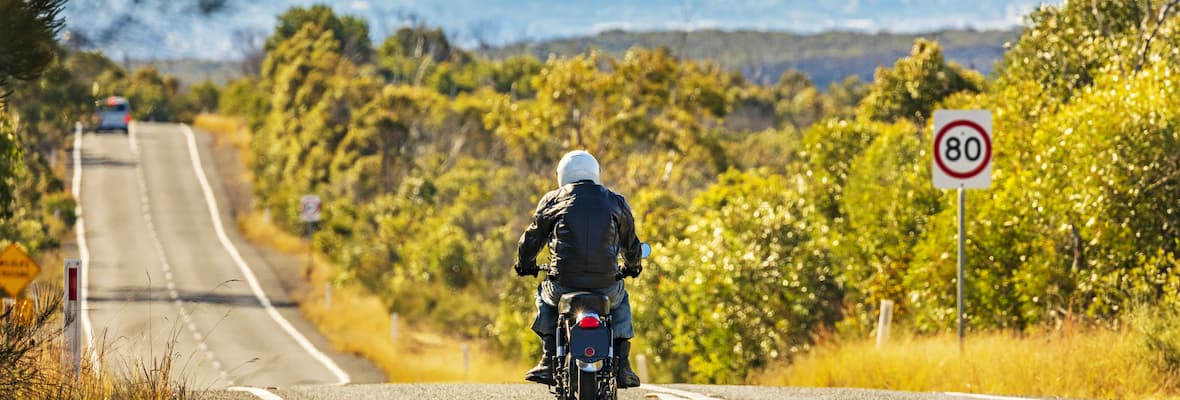 Person rides motorbike on a NSW highway