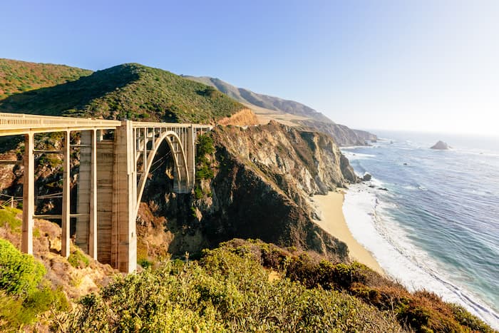 Bixby Creek Bridge takes cars over rocky canyons on the Pacific Coast Highway.