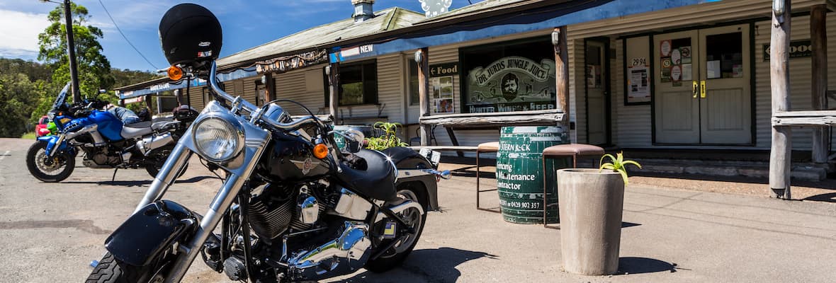 Cruiser motorcycle parked outside rural pub