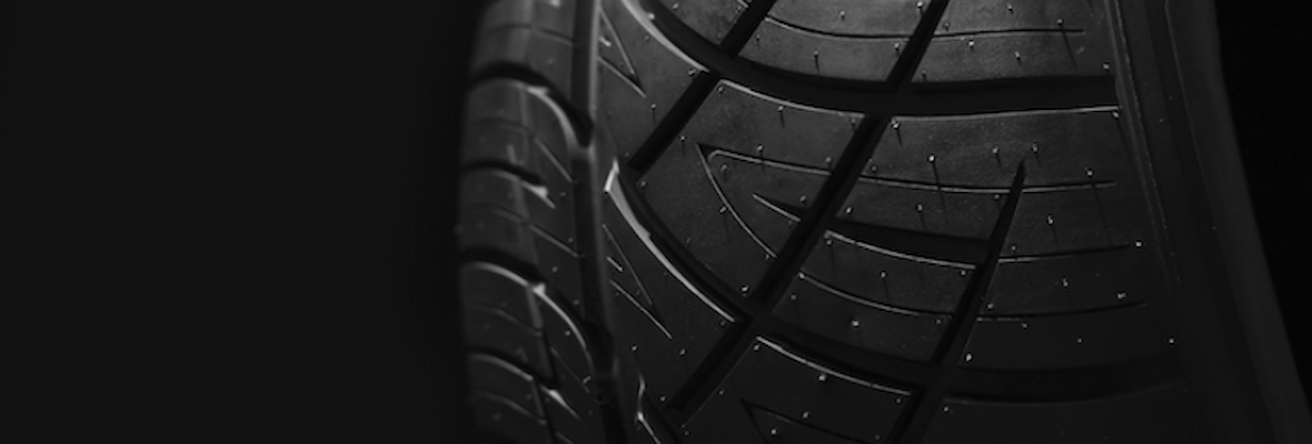 A close up of a car tyre tread with pattern