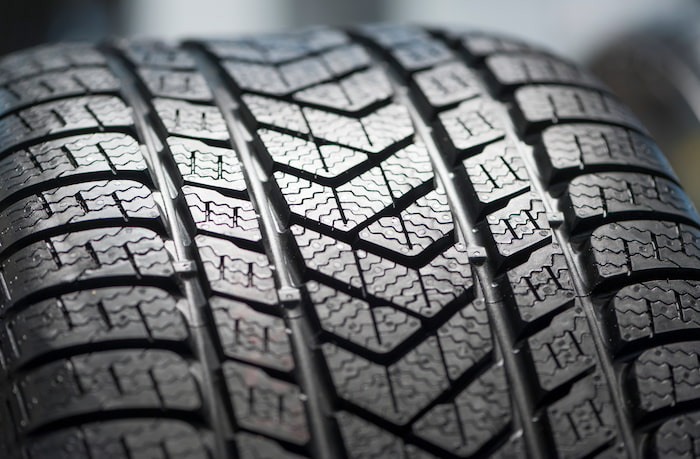 A car tyre that has a zigzag grippy tread