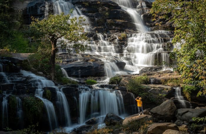 tourist at waterfalls in chiang mai thailand