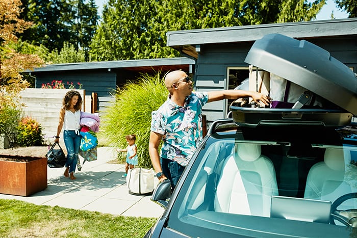Family packing the car for a trip