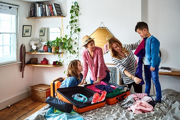Family packing luggage